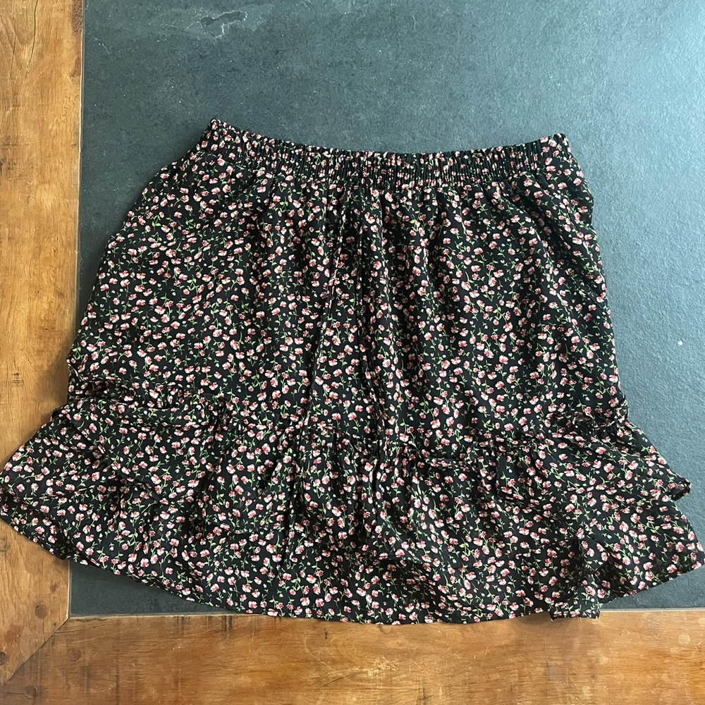 Black floral ruffle mini skirt